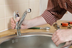 Plumber installing faucet Plumber installing faucet
